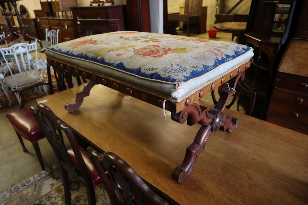 A William IV walnut X frame dressing stool with floral tapestry seat, width 100cm depth 65cm height 46cm